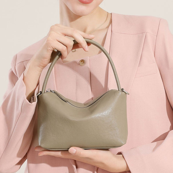 Bolso de mano vintage de piel de vaca para mujer, moderno y versátil, tipo almohada, tipo mensajero de un solo hombro.