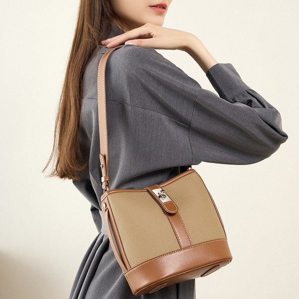 Bolso de cubo de piel de vaca de primera capa, bolso de cuero versátil para mujer, nuevo diseño de nicho popular, bolso de mensajero popular, bolso de hombro