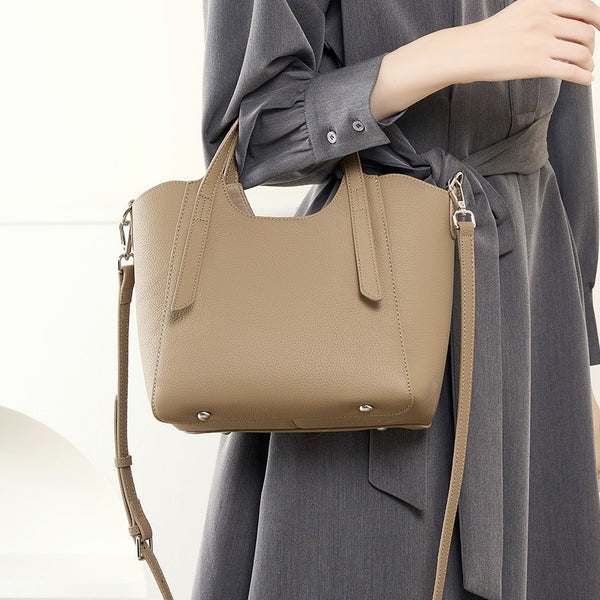 Bolso de mano con textura de piel de vaca de primera capa para mujer, bolso de mano estilo viajero, bolso bandolera de nueva tendencia popular.